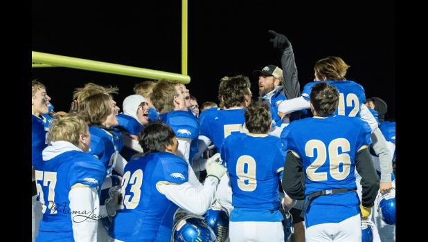 “This one’s for the whole community.” Coach Heathershaw Photo courtesy Mama Law Photography