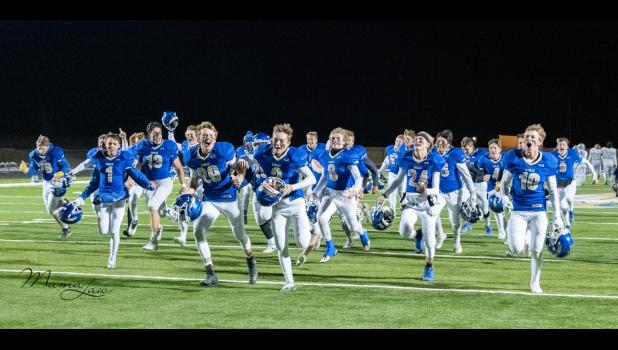The team raced to the end zone to celebrate their victory Photo courtesy Mama Law Photography