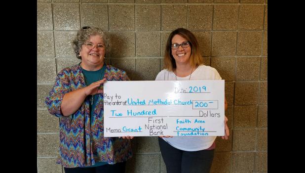 Connie Eichinger, Faith Methodist Church ... receiving a check for $200.00, with Faith Area Community Foundation board member Shalyn Hawley. courtesy photo