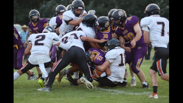 Tigers and Longhorns ... converge during the game last Thursday night. This was a common site as the Dupree Tigers preferred a running game strategy. Photo courtesy Alison Grueb