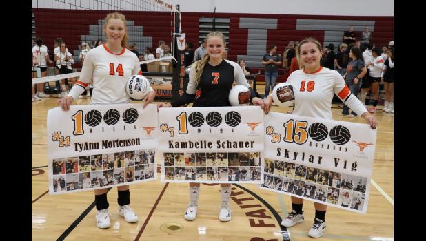 TyAnn Mortenson, Kambelle Schauer and Skylar Vig ... pictured with their commemorative items as they were honored during a recent game in Faith for reaching these goals during their high school volleyball careers. Photo Courtesy Alison Grueb