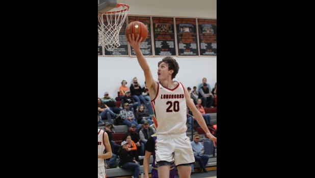 Tucker Miller ... adding to his total score of 10 points against the Ranchers during the varsity game. Photo courtesy Alison Grueb