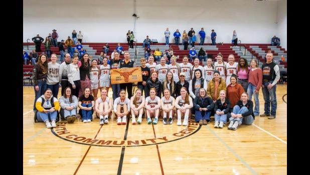 Coach Carmichael ... center with plaque, accompanied by current and former Lady Longhorns as well as current and former coaching staff. Photo courtesy Heather Senn
