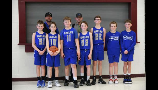 Pictured front row (l to r) Deacon Haerer, Tanner Volmer, Ryon Bielmaier, Owyn Geigle, Aidan Craven, Carter Sundall, Teelan Kjerstad. Back row (l to r) Assistant Coach Dar Haerer and Coach Ryan Kjerstad.