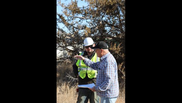 M.R. Hansen visits with the project manager from H&W Contracting of Sioux Falls, at the new housing lot development the City of Philip is undertaking.