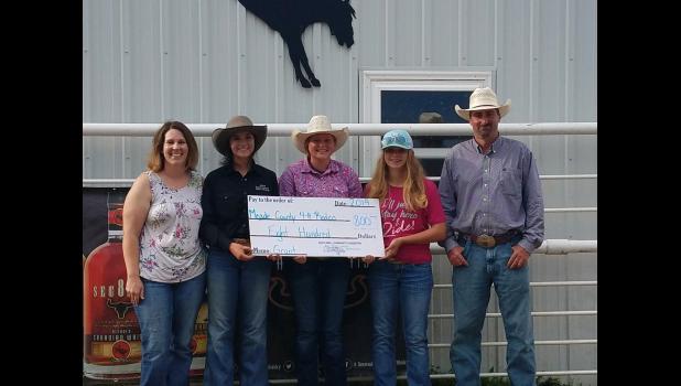 Meade County 4-H Rodeo ... receiving a check for $800.00, with Faith Area Community Foundation board member Shalyn Hawley. Courtesy photo