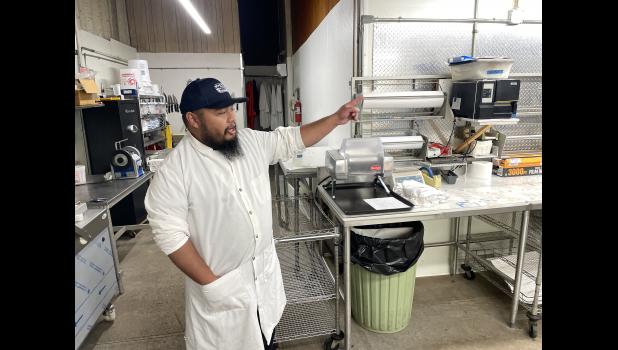 Chris Charfauros, manager of Wall Meat Processing, explains the process livestock go through from arrival to final cuts during a recent tour of the plant. Courtesy Bart Pfankuch/South Dakota News Watch