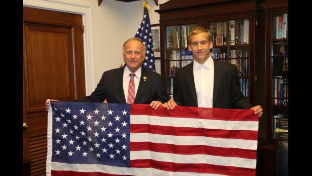 Iowa Congressman Steve King presents Luke with a flag flown over Capitol.