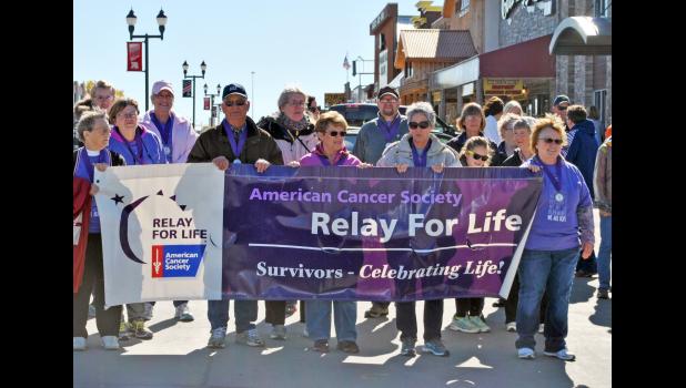 Though the rest of the annual event had to be moved indoors because of cold and windy weather, the starting off of the five kilometer walk was still led by many of the attending cancer survivors.