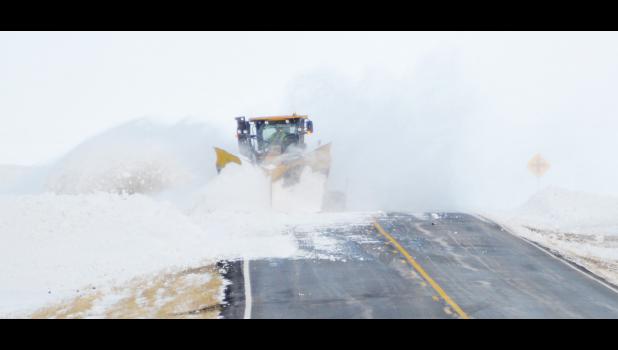 Meade County crews worked to clear drifts back from the highway to prevent more blowing and drifting. Even without fresh snowfall, drifts left too close to the road can cause travel problems when the wind moves the snow.