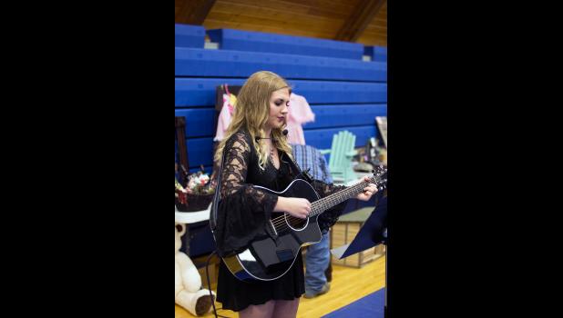 Photo by Barb Hockenbary. Local Jones County Senior and talent Molly Dowling provided musical entertainment during the event.