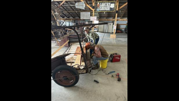 Brian Flatmoe and Brad Hatle working on the IHC Binder.