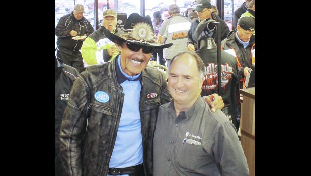 The annual Kyle Petty Charity Ride Across America fundraiser for the children’s Victory Junction camp stopped in Wall this year. Wall Mayor Marty Huether, right, presented a $1,000 community check to the cause. Shown is Richard Petty acknowledging the donation.