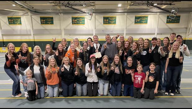 Coach Carmichael ... pictured with past players, coaching staff, managers and water girls following presentation of the Larry Luitjens award. Photo courtesy Amie Schauer