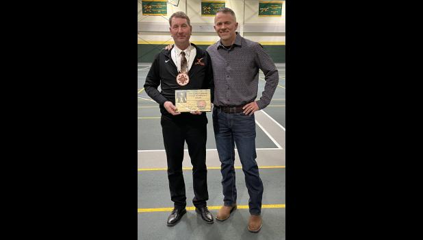 Bryan Carmichael ... FHS Lady Longhorns Head Coach being presented with Larry Luitjens award. Photo courtesy Amie Schauer