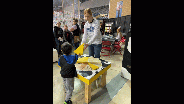 TyAnn Mortenson … assisting with the cheese puzzle. Photo courtesy Elke King