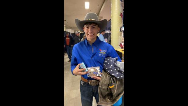 Jackson Spencer with winning buckle. Courtesy Photo