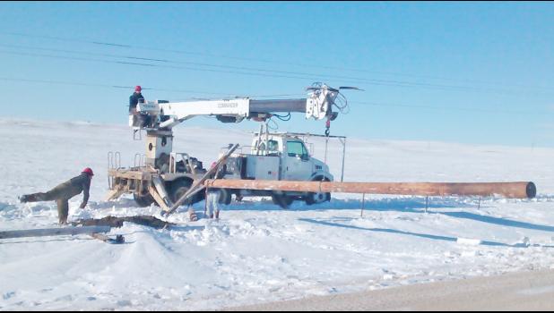 A private contracting crew from Reva, was called in to help restore power by putting in new poles along the Stoneville Road north of Union Center. Crews battled deep snow as they worked to repair downed lines.