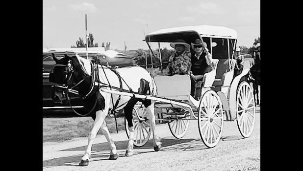 Grand marshal, Lorna Moore, rides in style during the parade celebrating the community of Quinn. Courtesy Elizabeth Meighen