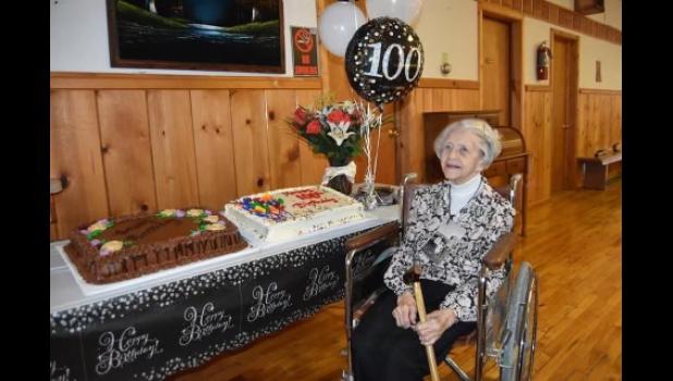 Irean Jordan ... pictured with two birthday cakes in celebration of 100 years and a crowd gathering in her honor. Photo courtesy Jared Fosheim