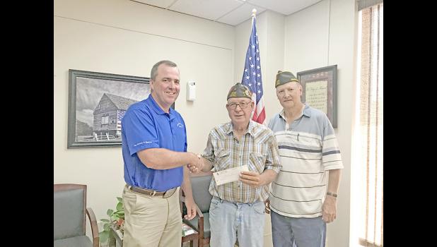 Scott Gray, Branch Manager, First National Bank; David Haines, Commander, of VFW Post 5751, and William Gropper, Quarter Master of VFW Post 5751 ... Mr. Gray is presenting Mr. Haines and Mr. Gropper with a donation for repairs to the VFW building. Courtesy Photo