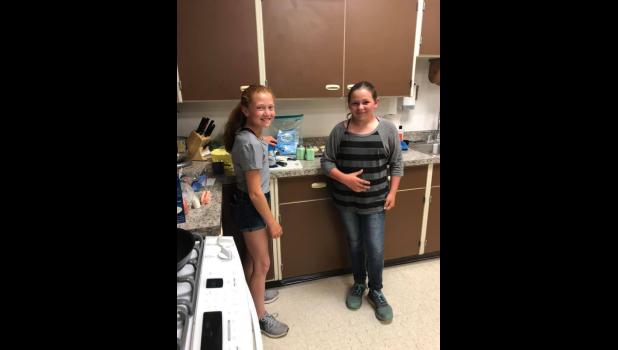 Presley Johnson and Cashley King … ready to cook their partner meal of Garlicky Shrimp Alfredo Bake. Courtesy Photo