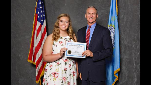 Jones County High School senior and valedictorian Aliana Kell received an award for her academic accomplishments at the Academic Excellence Banquet in Pierre on Monday, April 24. Congratulations and well done, Aliana! Pictured above is Kell with South Dakota Governor Dennis Daugaard.