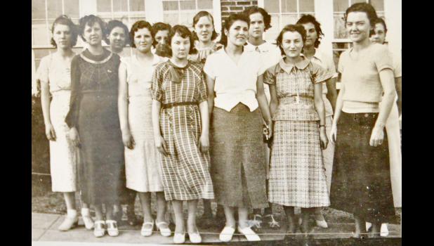 The New Underwood Girls' Athletic Association of 1936 pose in front of the school. Back, l-r: Doris Fernau, Phyllis Hofer, Darlene Burchard, Lucille Wallis, Inez Hofer, Bernice Reed, LaValle Burchard. Front, l-r: Louella Storm, Vera Walthall, Natalie Swanson, Arlene Morey, Amy Kopp, Miss Muriel Hebbert.