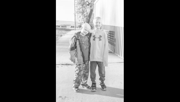 Bowden Aske (left) and Mason Martinez (right). Mason completed a 10 mile run from Draper to Murdo on Saturday, October 29, to raise awareness for Pediatric Cancer Research in honor of his friend Bowden. Photo by Barb Hockenbary