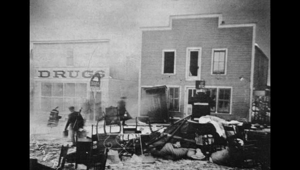 Unable to put out the fire, Murdo residents hauled furniture and other goods out of the doomed buildings and placed it on the street. Images courtesy Wayne Esmay