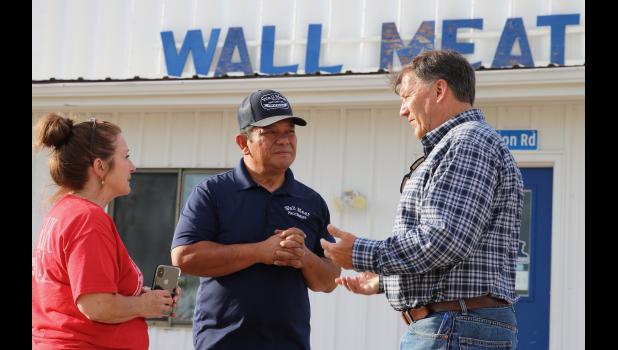 U.S. Sen. Mike Rounds, at right, met with Wall Meat Processing representatives during a recent visit to the plant. Rounds supports expansion of regional meat packing plants in the state. Courtesy Bart Pfankuch/South Dakota News Watch