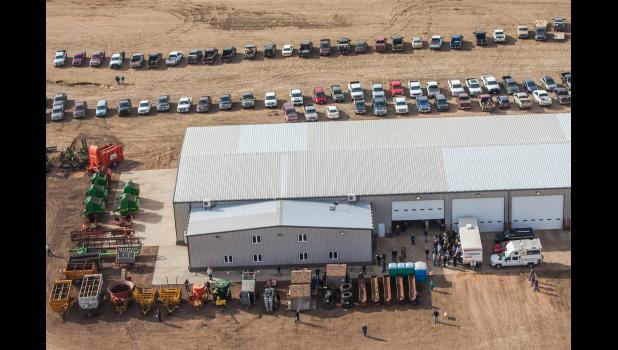 Rows of farm machinery and vehicles surrounded the Dowling shop. Cars lined the dirt roads from the shop leading all the way to Draper.