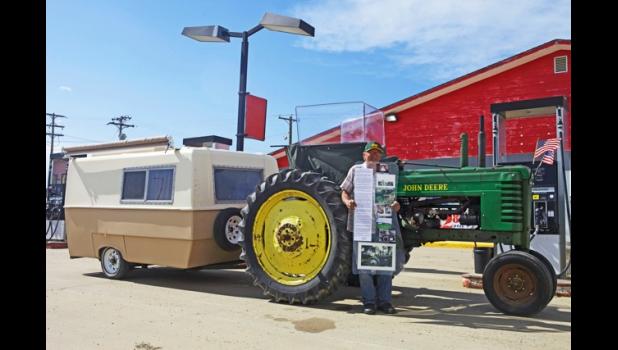 Dewey Brooks stopped at the co-op in Murdo to fill up his tractor and to answer questions from curious by-standers. Photo by Rylee Metzger