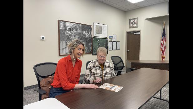 Kendall Nelson, director of the Wall Economic Development Corporation, and Wall Mayor Mary Williams review information regarding all the recent developments in Wall. Photo courtesy of Elizabeth Meighen