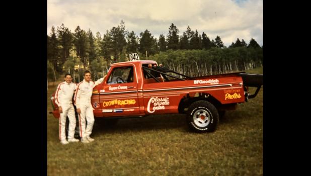 Byron Crown and his Uncle, Doug Crown stand by the bright colored, Crown Racing truck 842 in the early racing days. Courtesy Photo