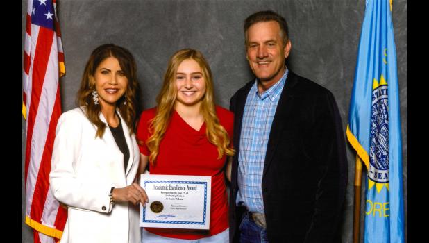 Kaycee Groves ... Faith High School’s top senior for the Class of 2022, pictured with Governor Noem(left) and Lieutenant Governor Larry Rhoden(right). Courtesy photo