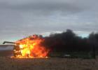 Combine lost in sunflower harvest inflicted fire.