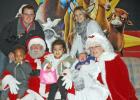 ​The Brit Miller family took the opportunity to pose with Santa and Mrs. Claus.