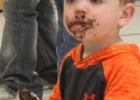 Scottie Fest, the carnival-like annual school organization and class fundraiser, was Thursday, April 20, in the Philip High School fine arts building. This year’s theme was Candy Land. Some, like this tyke, dove into the candy and other treats, before he got them home.