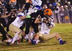 Philip’s Nick Donnelly keeps working for every inch toward the goal line, even against four Wall tacklers. (Barb Hockenbary photo)