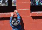Stretching ... is an important skill when egg hunting at the park. Photo courtesy Kim Bachman