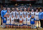The Wall Eagle basketball team with their State Runner-Up trophy. Back row (left to right): Manager: Dawson Hess, Head Coach: John Hess, Kadence Kusser, Taylor McDonnell, Paige Kjerstad, April Schulz, Skylie Wagner, Rhea Tucker, Alexis Stephen, Faith Frink, Jada Kusser, Assistant Coach: Madison McLaughlin, Bottom Row (left to right): Manager: Brittany Walker, Loucasey Tines, Fallon Ostenson, Nora Dinger, Chloe Fortune, Macee Paulsen, Maranda Poor Bear, and Manager: Karmyn Kjerstad. Photo Courtesy Mama Law Photography