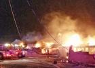 Crews work diligently to put out the early morning motel fire.