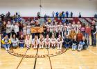 Coach Carmichael ... center with plaque, accompanied by current and former Lady Longhorns as well as current and former coaching staff. Photo courtesy Heather Senn
