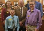 Front row (L-R): Matthew Birkeland and Dylan Fuoss. Back row (L-R): Brianna Smith, Representative James Schaefer and Ty Fuoss.