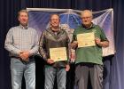 Honorees ... Mr. Doug Schauer and Mr. Craig Ness on stage with Mr. Bryan Carmichael who nominated them along with Mr. Mel Dutton and Coach Randi Faeth receiving certificates of recognition at Mitchell, SD. Photo courtesy Amie Schauer