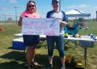 Faith Area Community Foundation board member Wendy Blunt … presents Faith Special Entertainment Committee member Jami Delbridge $500.00 in grant funds. Photo courtesy Shalyn Hawley