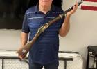 Glen Haines ... holding custom rifle he received in recognition of his 55 years with the Faith Volunteer Fire Department. Photo & info courtesy Lenae Hulm