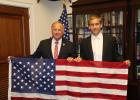 Iowa Congressman Steve King presents Luke with a flag flown over Capitol.