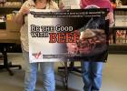 Lillian Helms and Kathy Hamann pictured with the gift card and sign that was sent to the Country Cupboard.